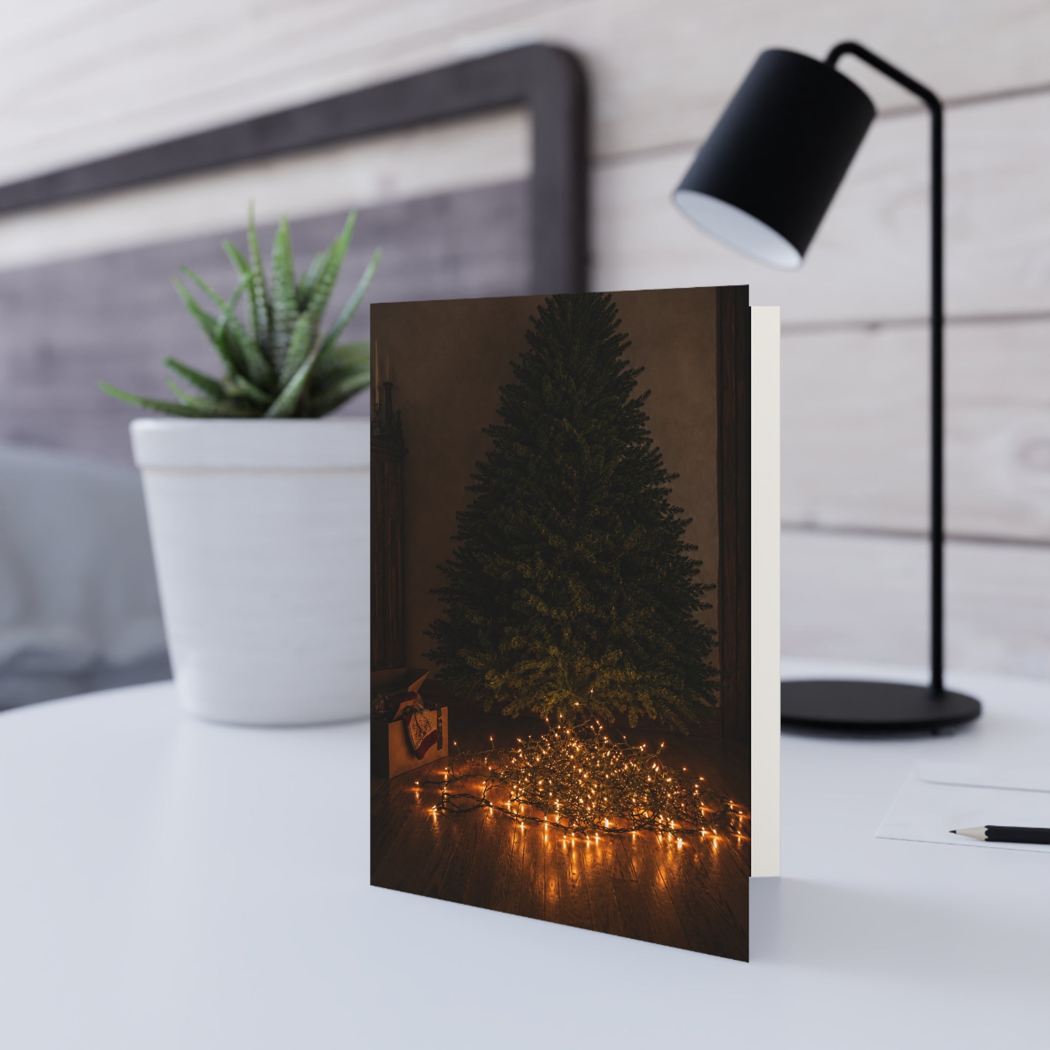 Unraveled. There's a nice irony to it. The lights are literally tangled, but the person who tried to untangle them has become the one who's unraveled. Christmas Tree Lights Greeting Card — Cozy Minimal Holiday Card