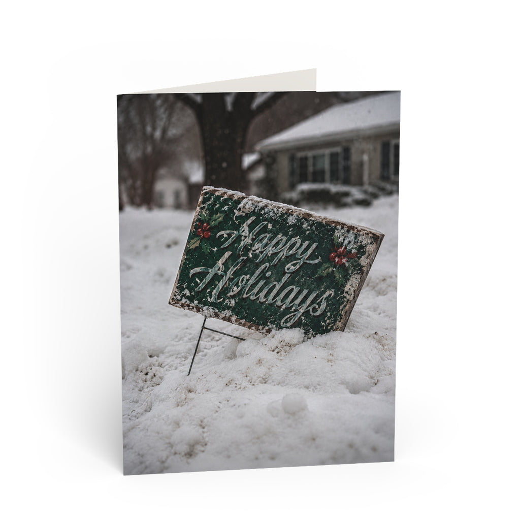Forecast / The forecast called for snow. It didn't mention quiet. The holiday greeting is still there, half covered, leaning into another winter day, waiting for the next passerby. / Holiday Greeting Card