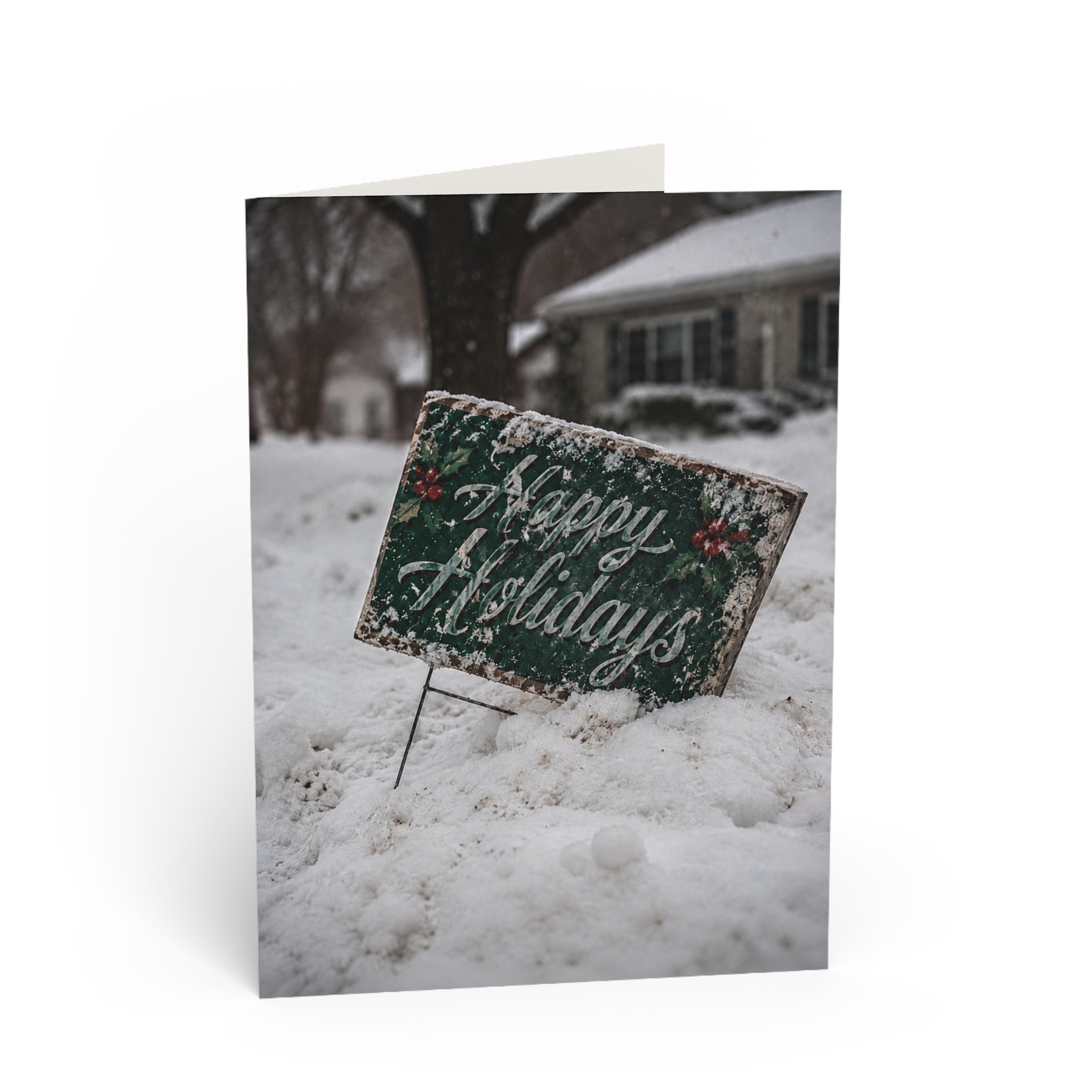 Forecast / The forecast called for snow. It didn't mention quiet. The holiday greeting is still there, half covered, leaning into another winter day, waiting for the next passerby. / Holiday Greeting Card