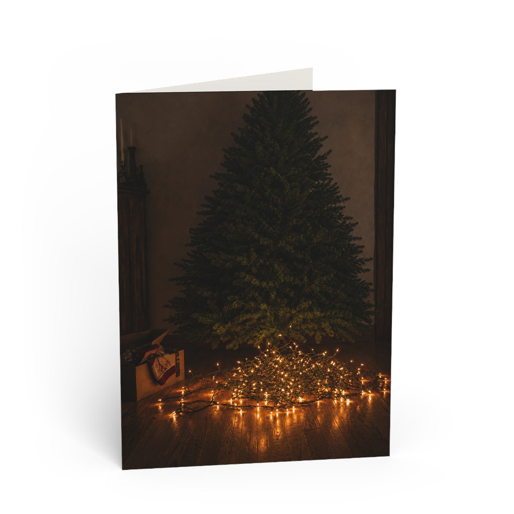 Unraveled. There's a nice irony to it. The lights are literally tangled, but the person who tried to untangle them has become the one who's unraveled. Christmas Tree Lights Greeting Card — Cozy Minimal Holiday Card