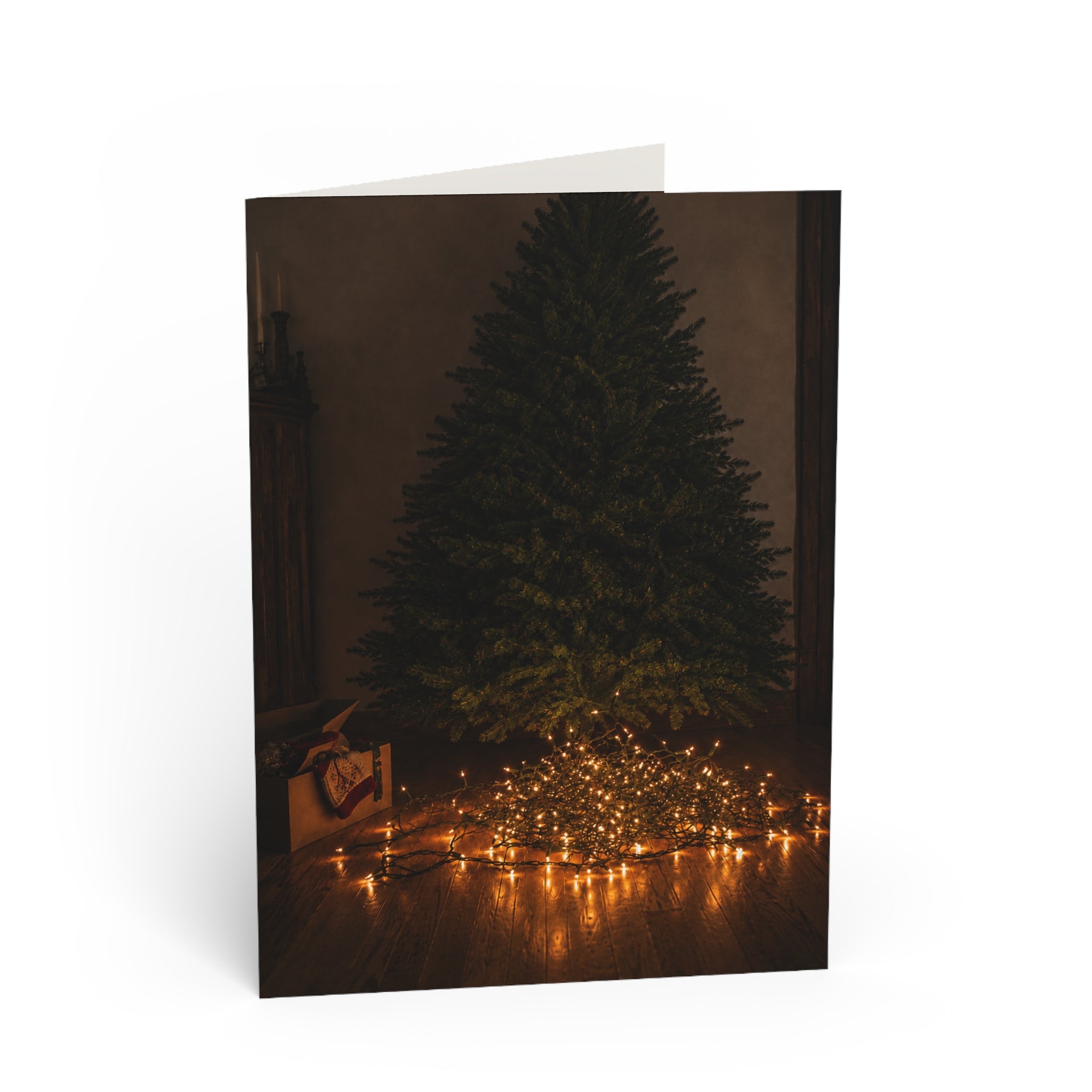 Unraveled. There's a nice irony to it. The lights are literally tangled, but the person who tried to untangle them has become the one who's unraveled. Christmas Tree Lights Greeting Card — Cozy Minimal Holiday Card